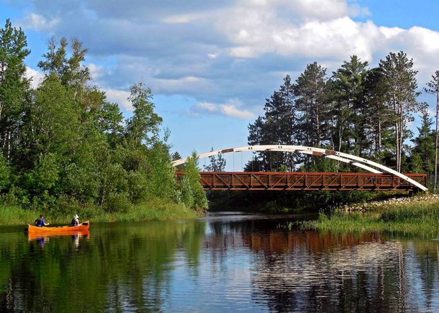 Mesabi Trail Bridge with canoe Paul Pluskwik