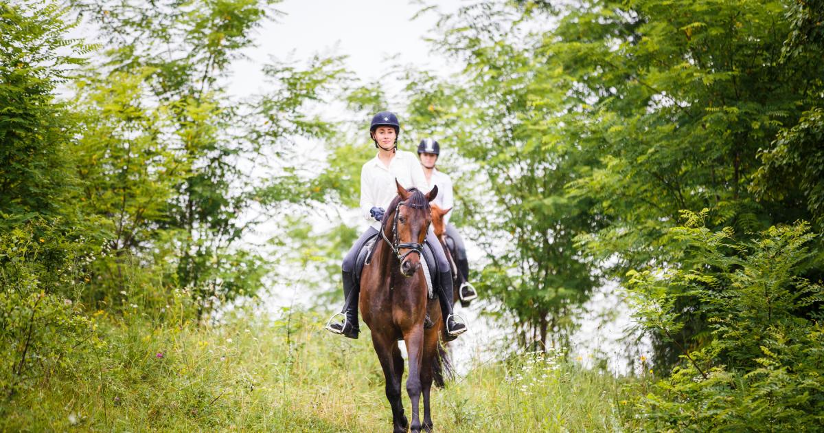 two-women-horseback-riding