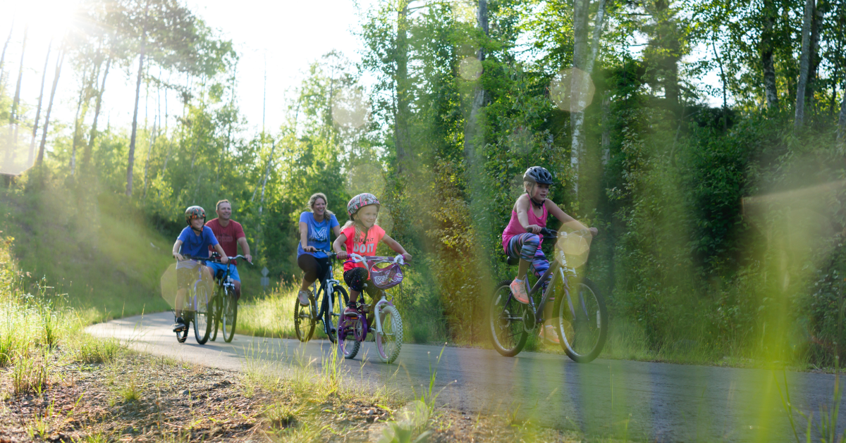 A family cycles on the paved Mesabi Trail in northern Minnesota. 