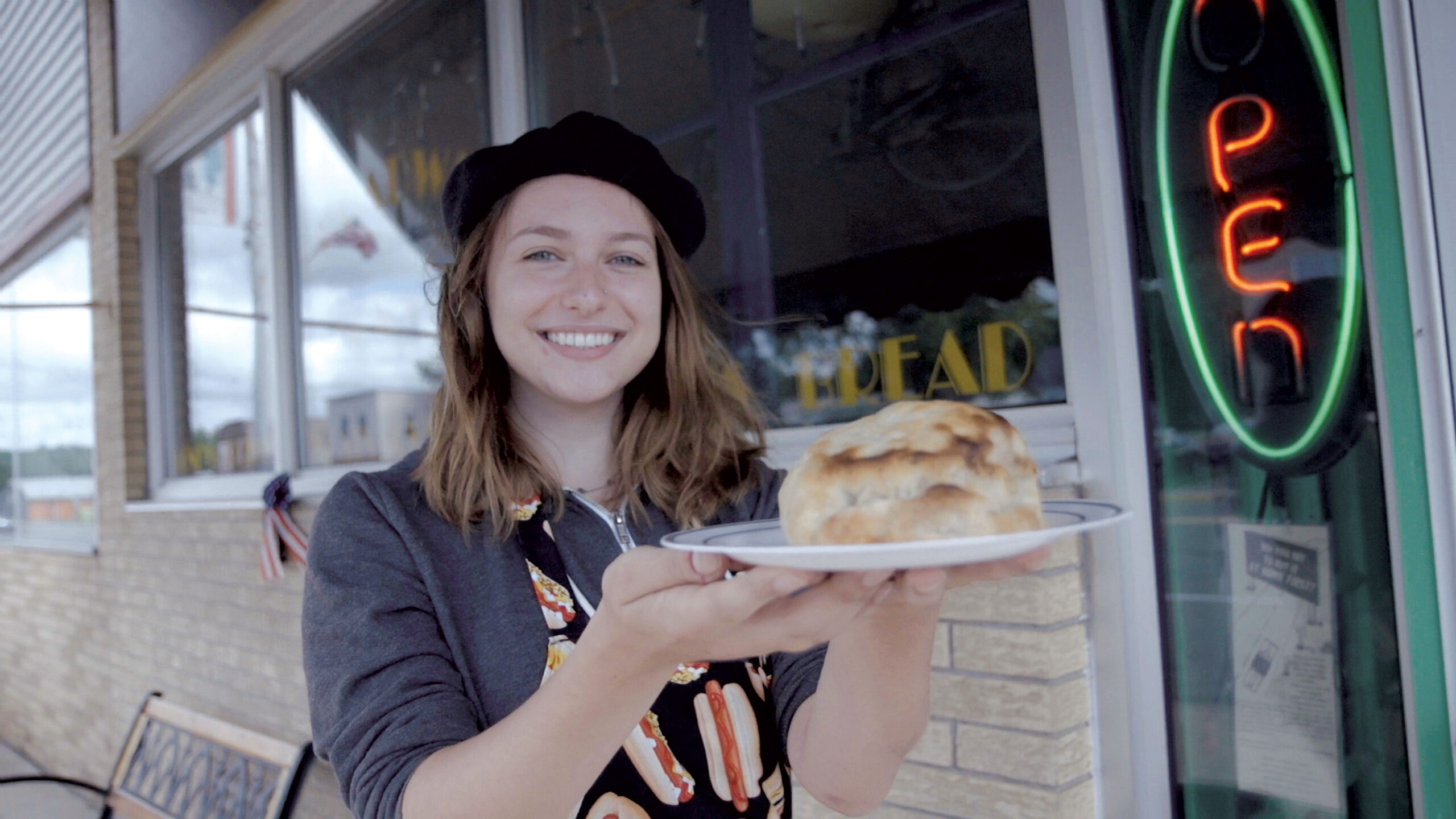 A server shows a homemade pasty from Virginia MN 