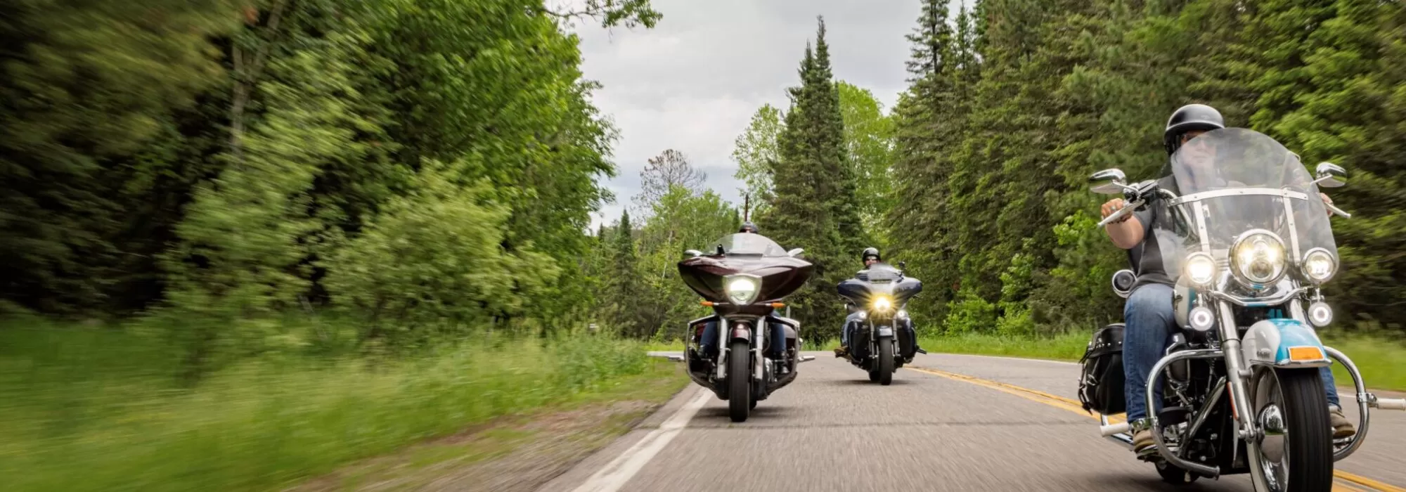 Three motorcycles scenic road