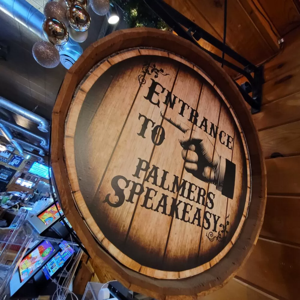 Sign in Hibbing Minnesota that says Entrance to Palmers Speakeasy