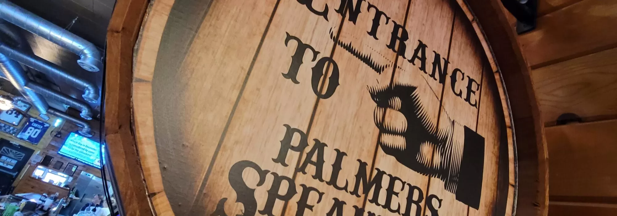 Sign in Hibbing Minnesota that says Entrance to Palmers Speakeasy