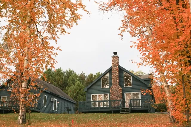 Fall leaves frame a view of a rental villa at Giants Ridge in northern Minnesota