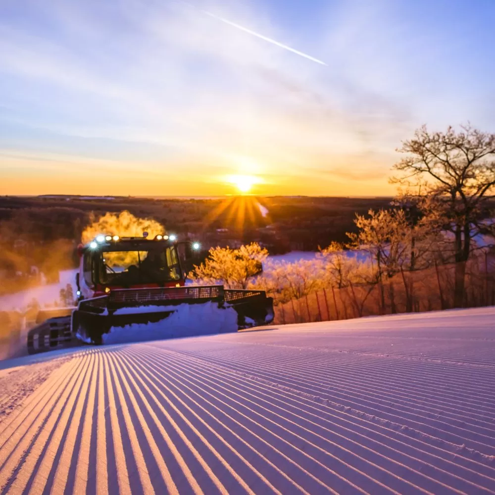 A ski groomer crests a hill at Giants Ridge resort in northern Minnesota