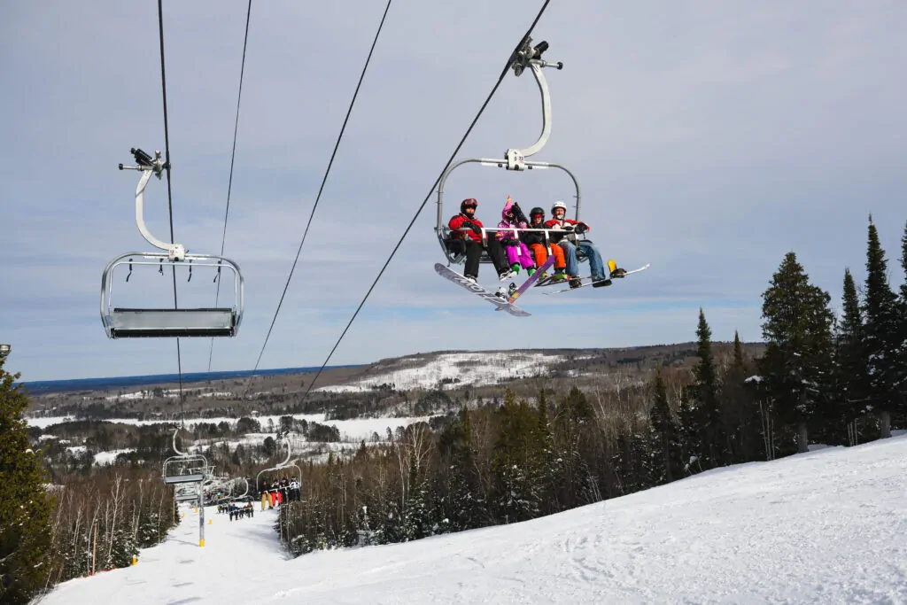 A family rides the open ski lift at Giants Ridge in Biwabik, Minnesota. 